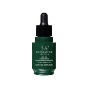 ProtoClinical k-beauty [NATURE REPUBLIC] Expert Drop Intense Barrier Ampoule 25ml dark green bottle silhouette with soft lilac side panels on a light background.