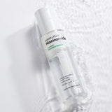 ProtoClinical k-beauty [NATURE REPUBLIC] The First Niacinamide Treatment Essence 150ml shown as a single centered gray bottle silhouette on a pale blue background with soft white side shading