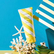 ProtoClinical k-beauty blue-green beauty product detail with soft gold tones on a light background.