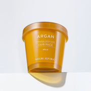 ProtoClinical k-beauty [NATURE REPUBLIC] Argan Essential Deep Care Hair Pack 470ml single upright orange hair pack packaging on a white background with pale blue corners.