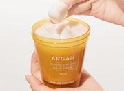 ProtoClinical k-beauty [NATURE REPUBLIC] Argan Essential Deep Care Hair Pack 470ml single upright orange hair pack tube on a light background.