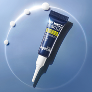 ProtoClinical k-beauty blue beauty product silhouette with a dark center on a light background.