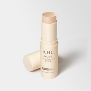 ProtoClinical k-beauty AHC Nude Concealing Stick SPF50+ PA++++ 10g single beige concealing stick package centered on a light background with soft blue upper-left accents.