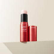 ProtoClinical k-beauty AHC Tension Eye Cream Stick For Face 10g single upright pink eye cream stick centered on a peach and cream background