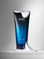 ProtoClinical k-beauty AHC Only For Man Foam Cleanser 140ml single upright dark blue foam cleanser package centered on a pale background with soft pink side accents.
