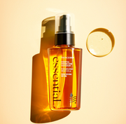 ProtoClinical k-beauty THE FACE SHOP Essential Damage Care Hair Serum 100ml single upright amber-beige bottle centered on a pale cream background with light side panels.