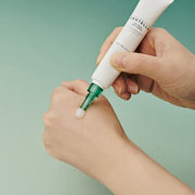 ProtoClinical k-beauty SKIN1004: Madagascar Centella Tea-trica Spot Cream (20ml) abstract product graphic with mint green side bands, a warm beige horizontal center, and muted olive vertical shapes on a pale background