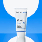 ProtoClinical k-beauty WELLAGE Real Hyaluronic Blue Sun Cream SPF50+ PA++++ 50ml single upright sun cream tube with blue-and-cream packaging on a light background.