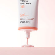 ProtoClinical k-beauty WELLAGE Real Hyaluronic Tone-up Sun Cream SPF50+ PA++++ 50ml single upright sun cream tube in blush beige packaging on a light background.
