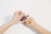ProtoClinical k-beauty light beige cosmetic bottle on a light background.