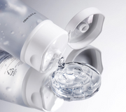 ProtoClinical k-beauty muted beauty packaging on a soft gray and beige background.