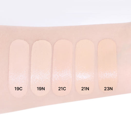ProtoClinical k-beauty product packaging in cool gray tones on a light background.