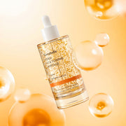ProtoClinical k-beauty Genabelle PDRN Vita Toning Ampoule 70ml clear ampoule bottle tilted with a white dropper cap, yellow vitamin beads, and floating golden bubbles on a warm yellow background