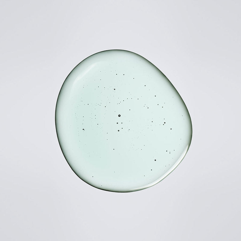 ProtoClinical k-beauty vivid coral beauty detail with a dark center on a pale background.