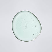 ProtoClinical k-beauty vivid coral beauty detail with a dark center on a pale background.