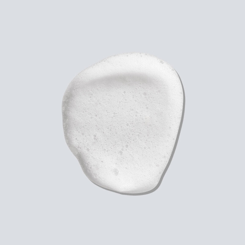 ProtoClinical k-beauty vivid coral beauty detail with a dark center on a pale background.