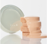 ProtoClinical k-beauty soft beige beauty product silhouette with peach and aqua side accents on a light background.