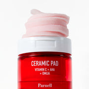 ProtoClinical k-beauty soft pink beauty bottle silhouette with a vivid red lower section and dark side shading on a pale aqua background.