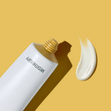 ProtoClinical k-beauty warm beige beauty graphic with a pale yellow upper band on a light background.