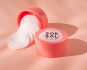 ProtoClinical k-beauty soft pink and brown beauty detail on a light background.