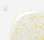 ProtoClinical k-beauty MEDITHERAPY Shumage Gold Seal Wrapping Mask 90g close-up of glossy translucent gel with scattered gold flecks on a white background