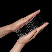 ProtoClinical k-beauty two dark beauty product shapes on a light background.
