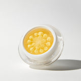 ProtoClinical k-beauty blue beauty graphic with a soft yellow center on a light background.