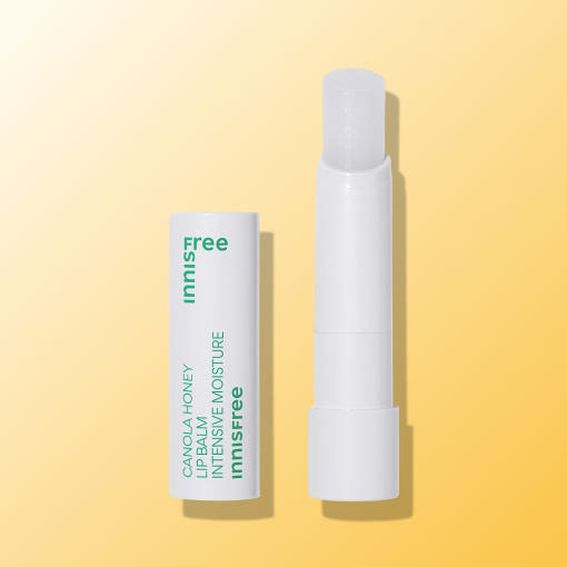 ProtoClinical k-beauty innisfree Canola Honey Lip Balm 3.5g [Intensive Moisture] in a warm yellow lip balm tube standing upright on a pale yellow background
