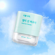 ProtoClinical k-beauty SHINGMULNARA: Multi Sun Powder SPF+ Pa (4g) single centered pale blue sun powder compact on a light aqua background.