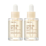 ProtoClinical k-beauty Shingmulnara Yuchae Flower Honey Watery Multi Oil 30ml+30ml shown as a single centered product packshot with warm amber and cream tones on a light background.