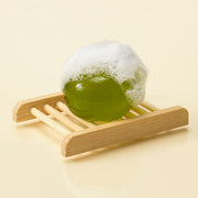 ProtoClinical k-beauty ongredients Jeju Green Tea Cleansing Ball 110g single round green cleansing ball centered on a light background.