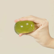 ProtoClinical k-beauty ongredients Jeju Green Tea Cleansing Ball 110g single round green cleansing ball centered on a light background.