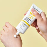 ProtoClinical k-beauty warm yellow and peach beauty graphic with a soft brown oval on a light background.