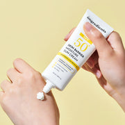 ProtoClinical k-beauty warm yellow and peach beauty graphic with a soft brown oval on a light background.