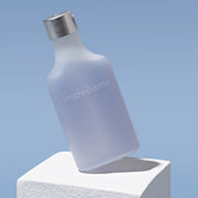 ProtoClinical k-beauty ongredients Anti-Wrinkle Essence 150m shown as a single upright blue essence bottle centered on a pale blue background
