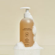ProtoClinical k-beauty warm beige beauty product packaging on a light background.