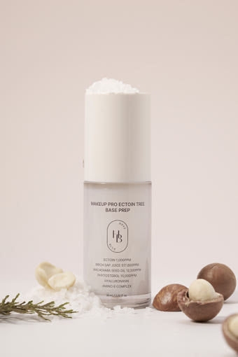 ProtoClinical k-beauty HEVEBLUE Makeup Pro Ectoin Tree Base Prep 30ml slim beige package silhouette with soft brown accents on a light background
