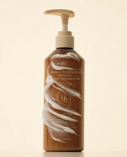 ProtoClinical k-beauty HEVEBLUE Salmon Pullkeratin Centella Hair Treatment 300ml single upright peach-orange bottle centered on a pale cream background.