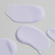 ProtoClinical k-beauty soft gray beauty graphic with a pale lavender edge on a light background.