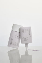 ProtoClinical k-beauty slim gray beauty product silhouette with a soft shadow on a light background.