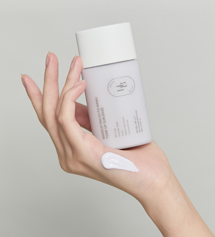 ProtoClinical k-beauty beige beauty bottle silhouette with a soft rose center on a light background.
