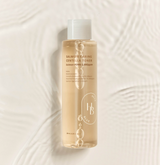 ProtoClinical k-beauty tall beige beauty bottle silhouette on a light background.