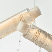 ProtoClinical k-beauty golden beauty bottle silhouette on a pale blue and white background.