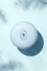 ProtoClinical k-beauty blue-gray beauty product on a pale blue background.