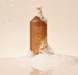 ProtoClinical k-beauty HEVEBLUE Salmon Pullkeratin Centella Hair Shampoo 500ml single warm brown shampoo bottle centered upright with pale peach side panels on a light background