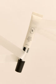 ProtoClinical k-beauty beauty product silhouette with a dark lower section and soft peach upper tones on a light background.