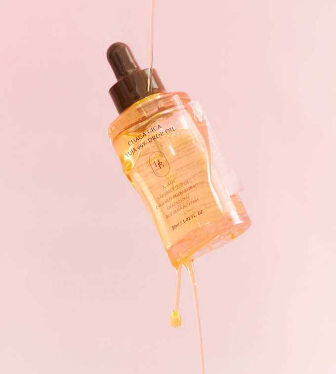 ProtoClinical k-beauty warm peach and beige beauty graphic with a soft vertical center on a light background.