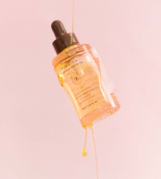ProtoClinical k-beauty warm peach and beige beauty graphic with a soft vertical center on a light background.