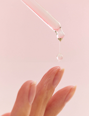 ProtoClinical k-beauty soft peach beauty product packaging with a pale vertical center on a light background.
