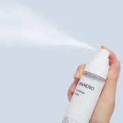 ProtoClinical k-beauty bravity DNAERO LumiAge Toner 100ml shown as a single light gray bottle upright and centered on a soft white background
